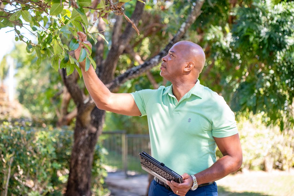 Nozzle Nolen employee inspecting for pests