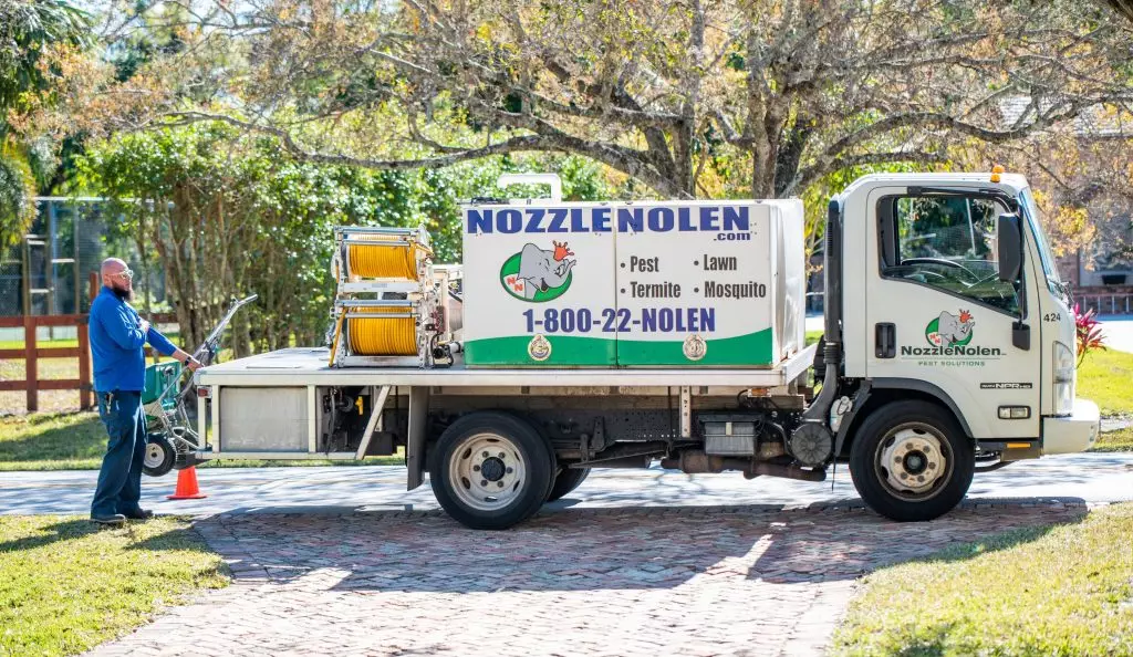 nozzle nolen technician outside with truck