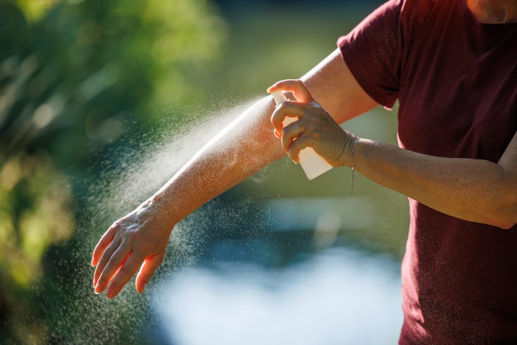 Man Applying Insect Spray