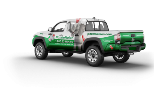 A green truck with a company logo "Nozzle Nolen" and a contact number on the side. The truck features an image of an elephant and a website URL, with the tagline "Pests, Termites, Lawn, Commercial.