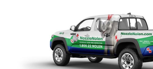 Pickup truck with Nozzle Nolen branding, featuring a green and blue design. An elephant mascot is printed on the side. The vehicle advertises pest control services with the website URL and phone number visible. The background is plain white.